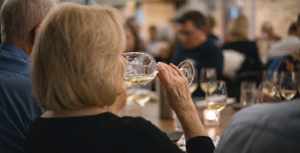 woman sipping wine